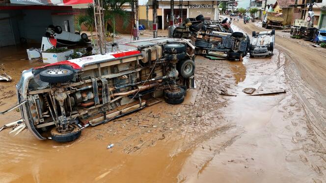 Overturned vehicles on a mud-covered street after heavy rains hit southeastern Brazil, in Mimoso do Sul, Espírito Santo state, March 24, 2024, in a photo released by local authorities .