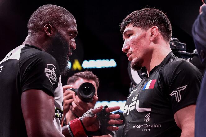 Cédric Doumbé, left, talks with Baysungur “Baki” Chamsoudinov at the end of their fight during the Professional Fighters League Europe (PFL) event at the Accor Arena in Paris, March 7, 2024.