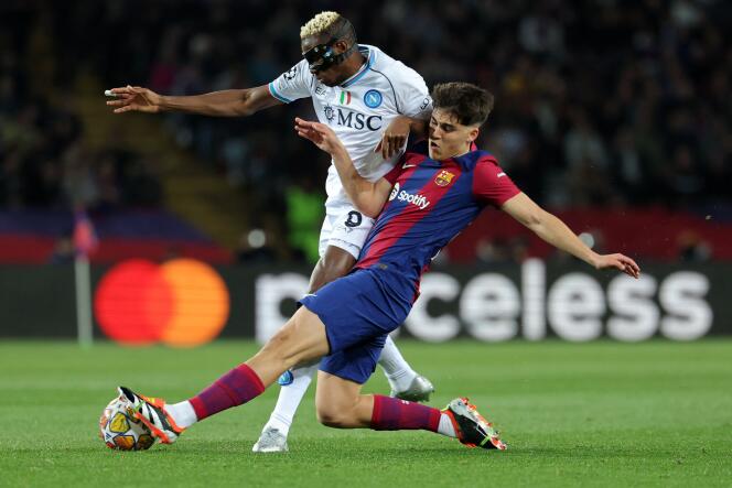 Barça defender Pau Cubarsi tackles Napoli striker Victor Osimhen in Barcelona on March 12, 2024.