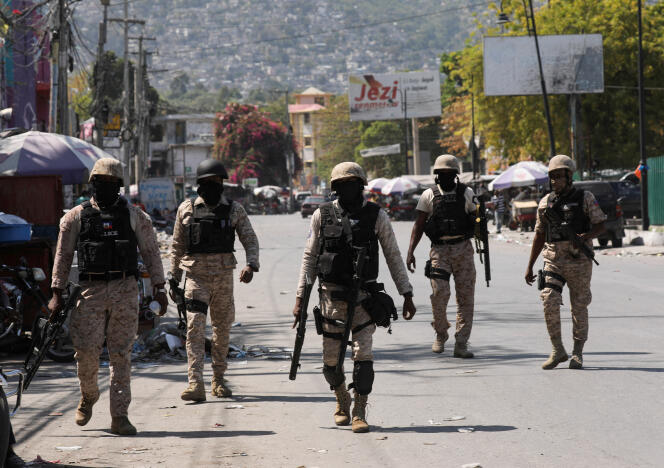 Haitian police patrol the streets of Port-au-Prince on March 8, 2024, after the establishment of a state of emergency.