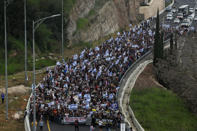 Families and supporters of hostages kidnapped during the deadly October 7 attack on Israel by the Palestinian Islamist group Hamas, take part in the four-day march from Reim to Jerusalem to demand the release of the hostages, near Mevaseret Zion, Israel , March 2, 2024. 