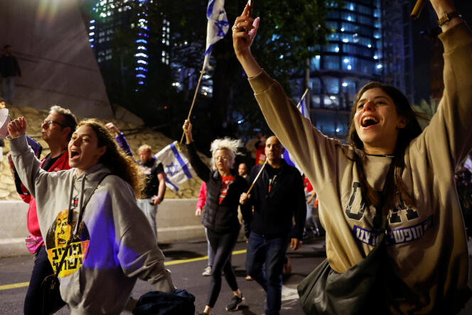 Demonstrators march during a demonstration against the government of Israeli Prime Minister Benjamin Netanyahu and for the release of hostages kidnapped by Hamas, in Tel Aviv, March 16, 2024.