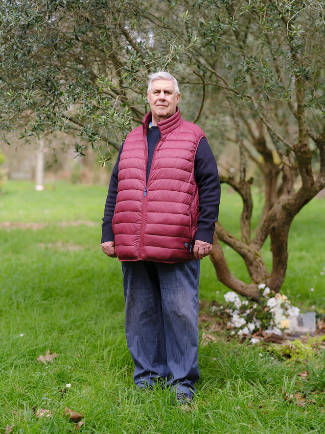 Jean-Luc Gicquel, secretary of the Les Jardins de memoire association, in front of the olive tree planted in memory of two of his grandchildren, in Pluneret (Morbihan), March 15, 2024.
