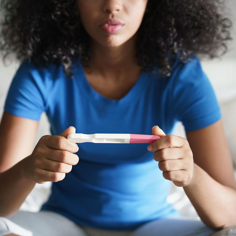 Unwanted pregnancy: woman with pregnancy test