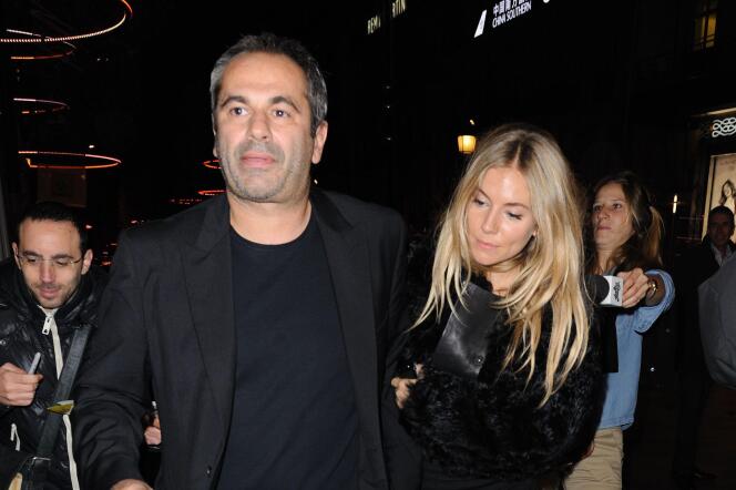 Businessman Jean-Yves Le Fur and actress Sienna Miller, in Paris, November 24, 2011.