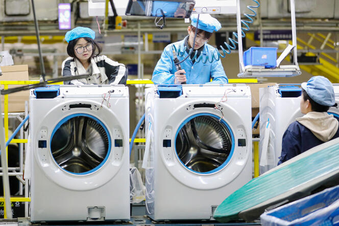 On a washing machine production line at a factory of Chinese home appliance and electronics company Haier in Qingdao, China's Shandong province, February 18.