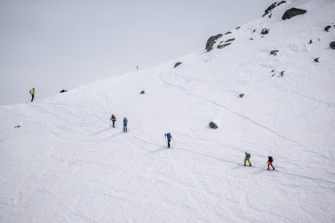 Skiers climb the Col de la Chaux above Verbier in the Swiss Alps, March 22, 2024. 